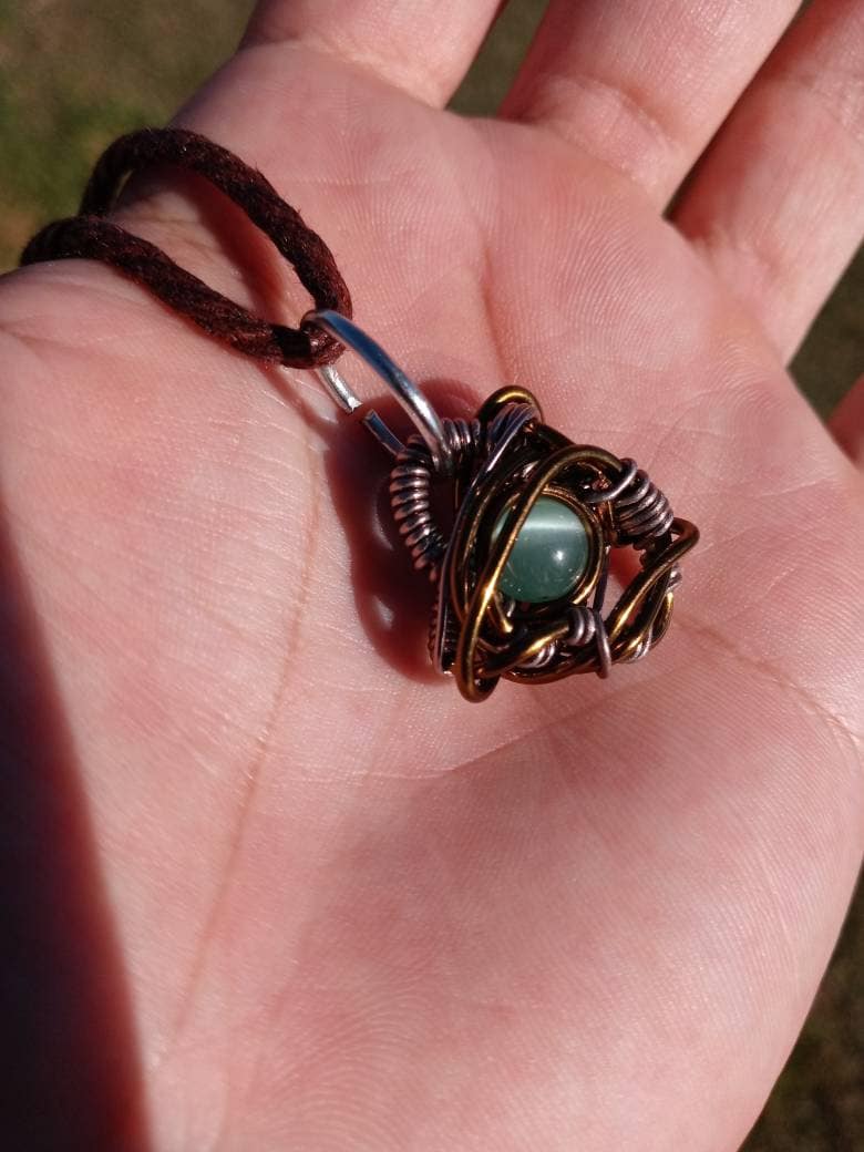 Nebulous. Cats Eye glass necklace. Made by Eyesthatburnthemind.