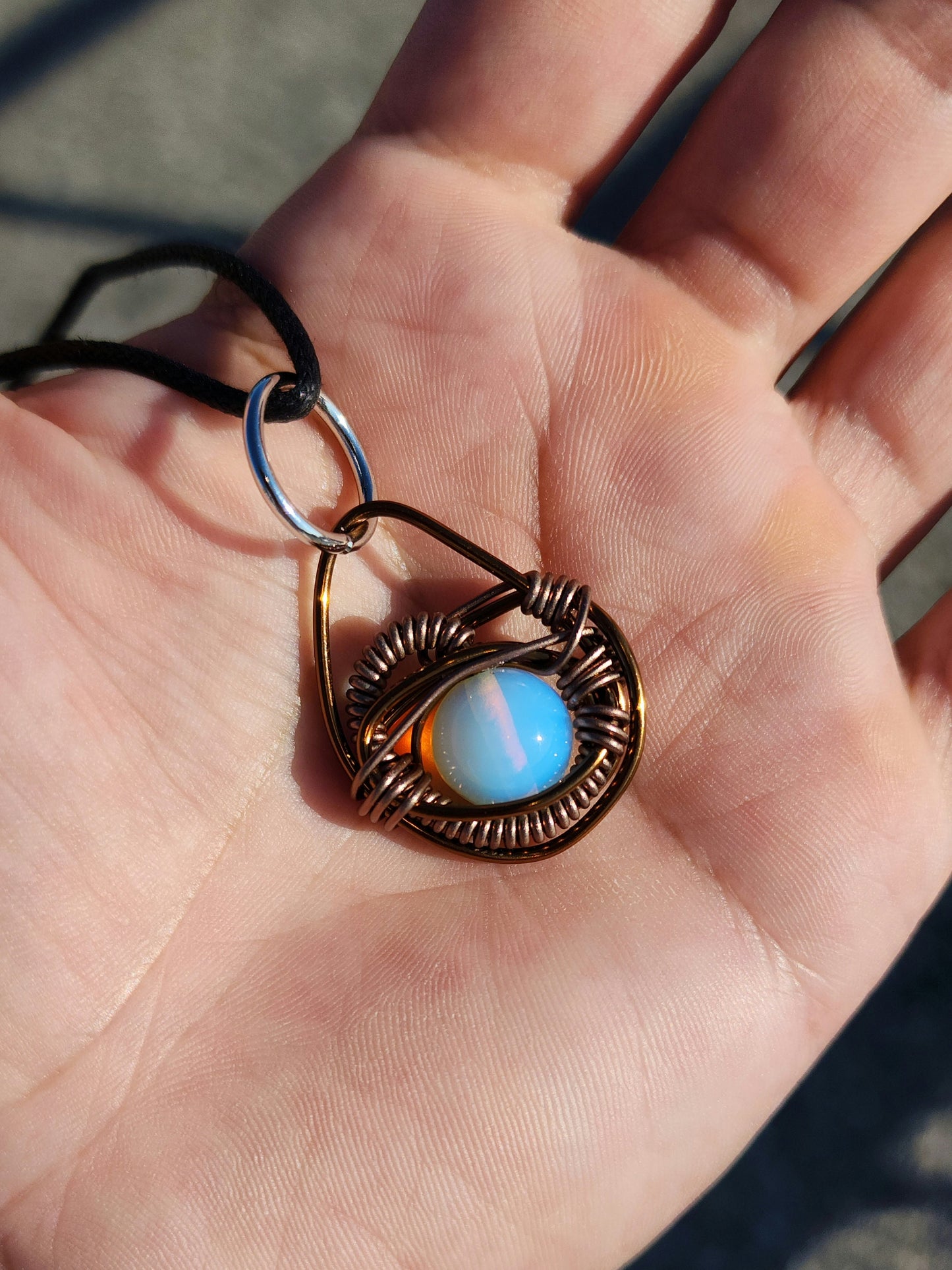 Eye of A Serpent. Opalite necklace. Made by Eyesthatburnthemind