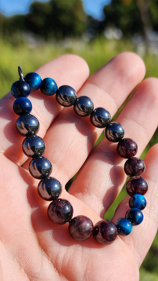 Primary Textures. Hematite, Garnet and Blue Tigers Eye Crystal Bracelet. Made by Eyesthatburnthemind.