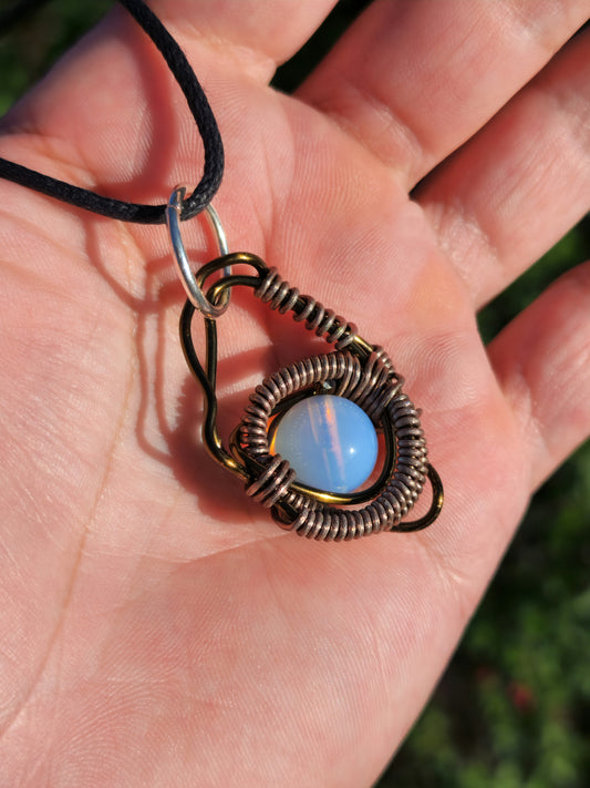 Eye of a Serpent. Opalite necklace. Made by Eyesthatburnthemind.