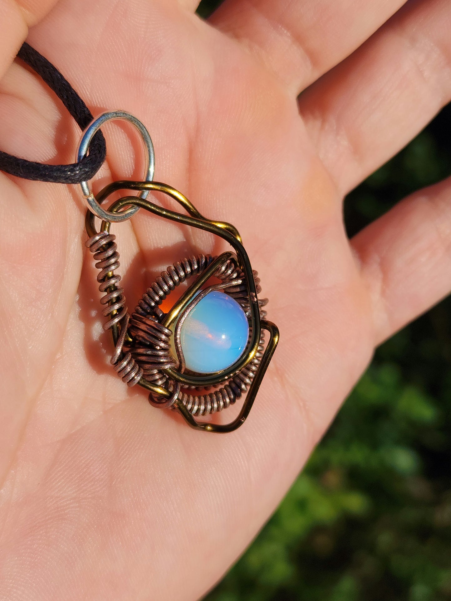 Eye of a Serpent. Opalite necklace. Made by Eyesthatburnthemind.