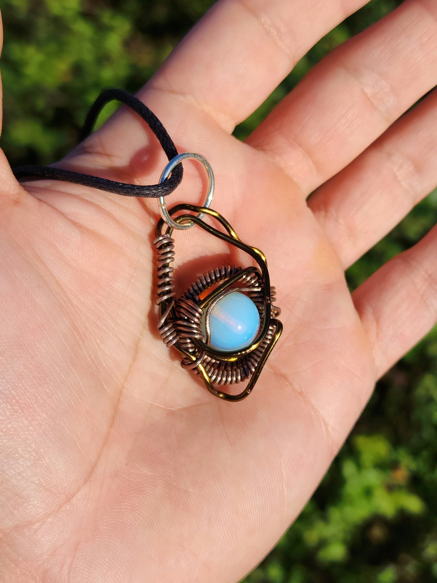 Eye of a Serpent. Opalite necklace. Made by Eyesthatburnthemind.