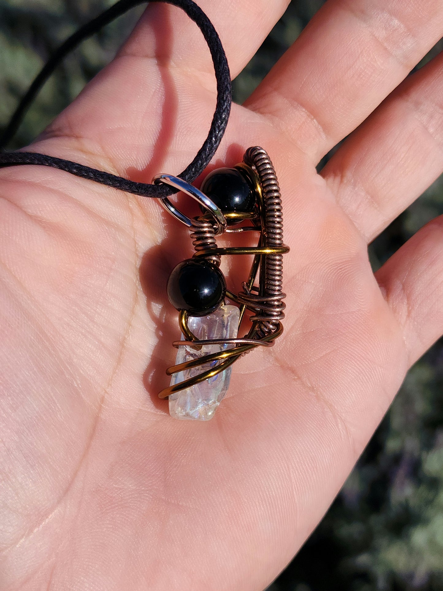 Twisted Scimitar. Onyx and Clear Quartz Crystal Necklace. Made by Eyesthatburnthemind.