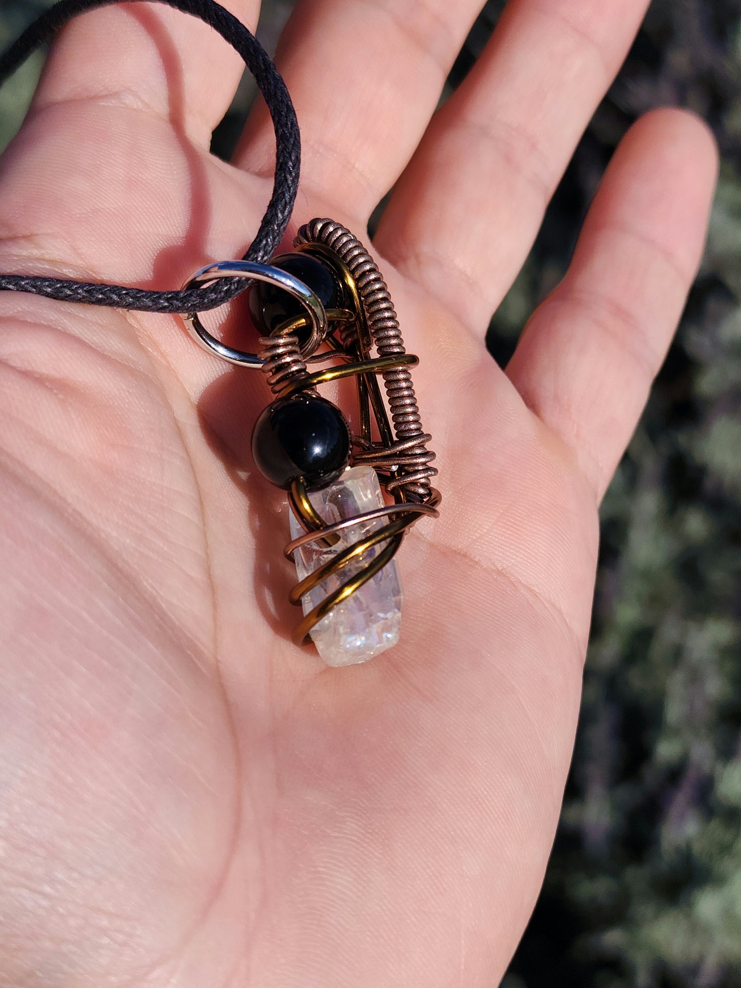 Twisted Scimitar. Onyx and Clear Quartz Crystal Necklace. Made by Eyesthatburnthemind.