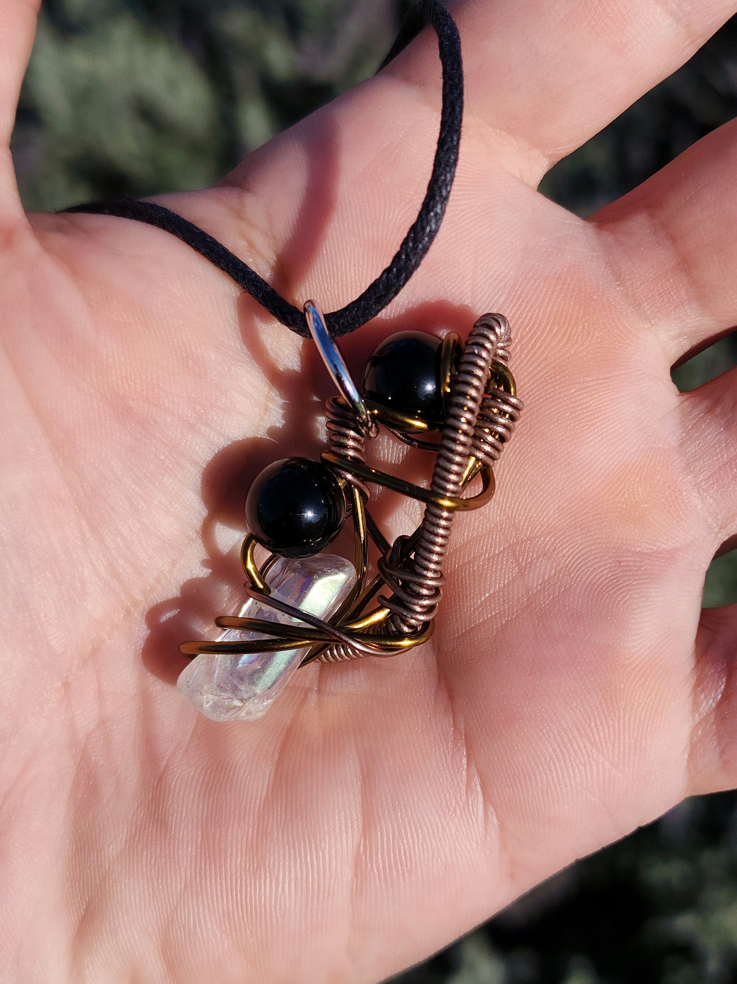 Twisted Scimitar. Onyx and Clear Quartz Crystal Necklace. Made by Eyesthatburnthemind.