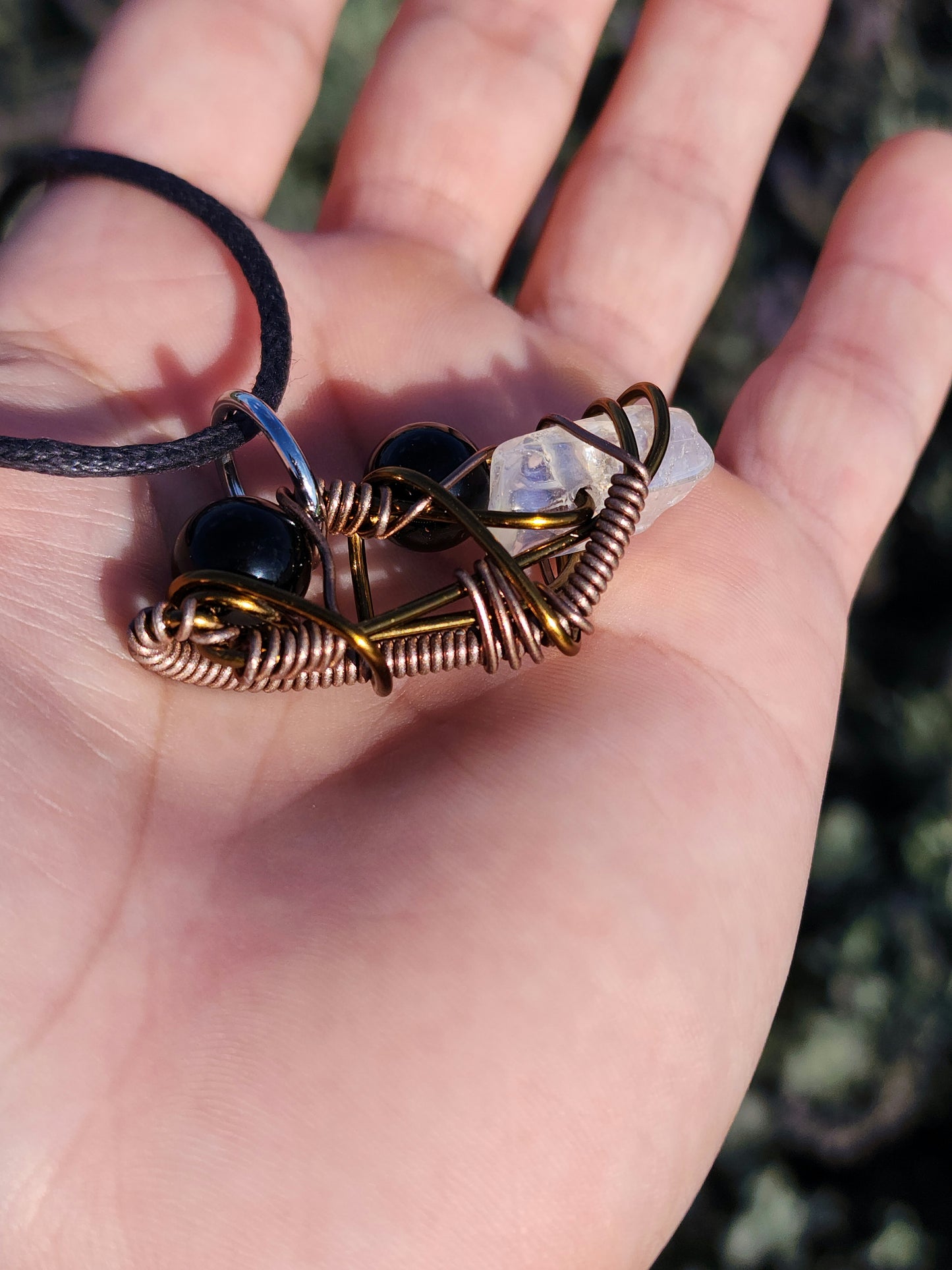 Twisted Scimitar. Onyx and Clear Quartz Crystal Necklace. Made by Eyesthatburnthemind.