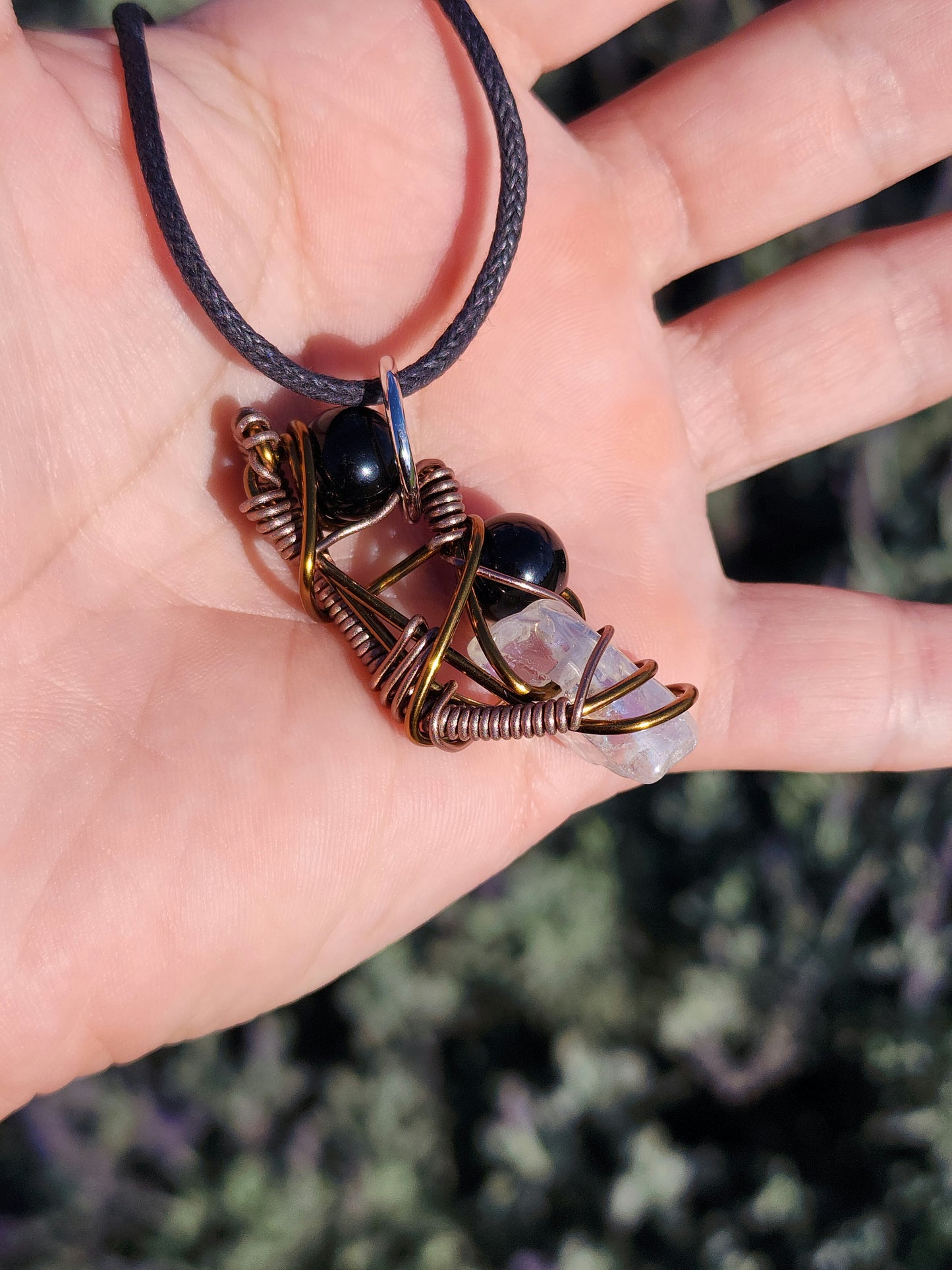 Twisted Scimitar. Onyx and Clear Quartz Crystal Necklace. Made by Eyesthatburnthemind.