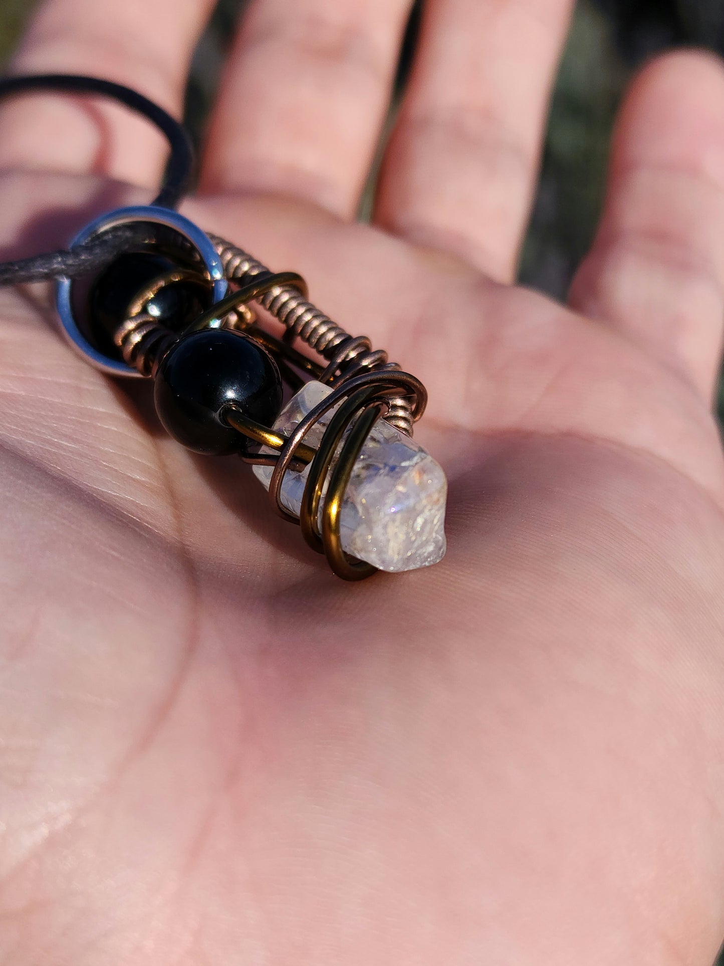 Twisted Scimitar. Onyx and Clear Quartz Crystal Necklace. Made by Eyesthatburnthemind.