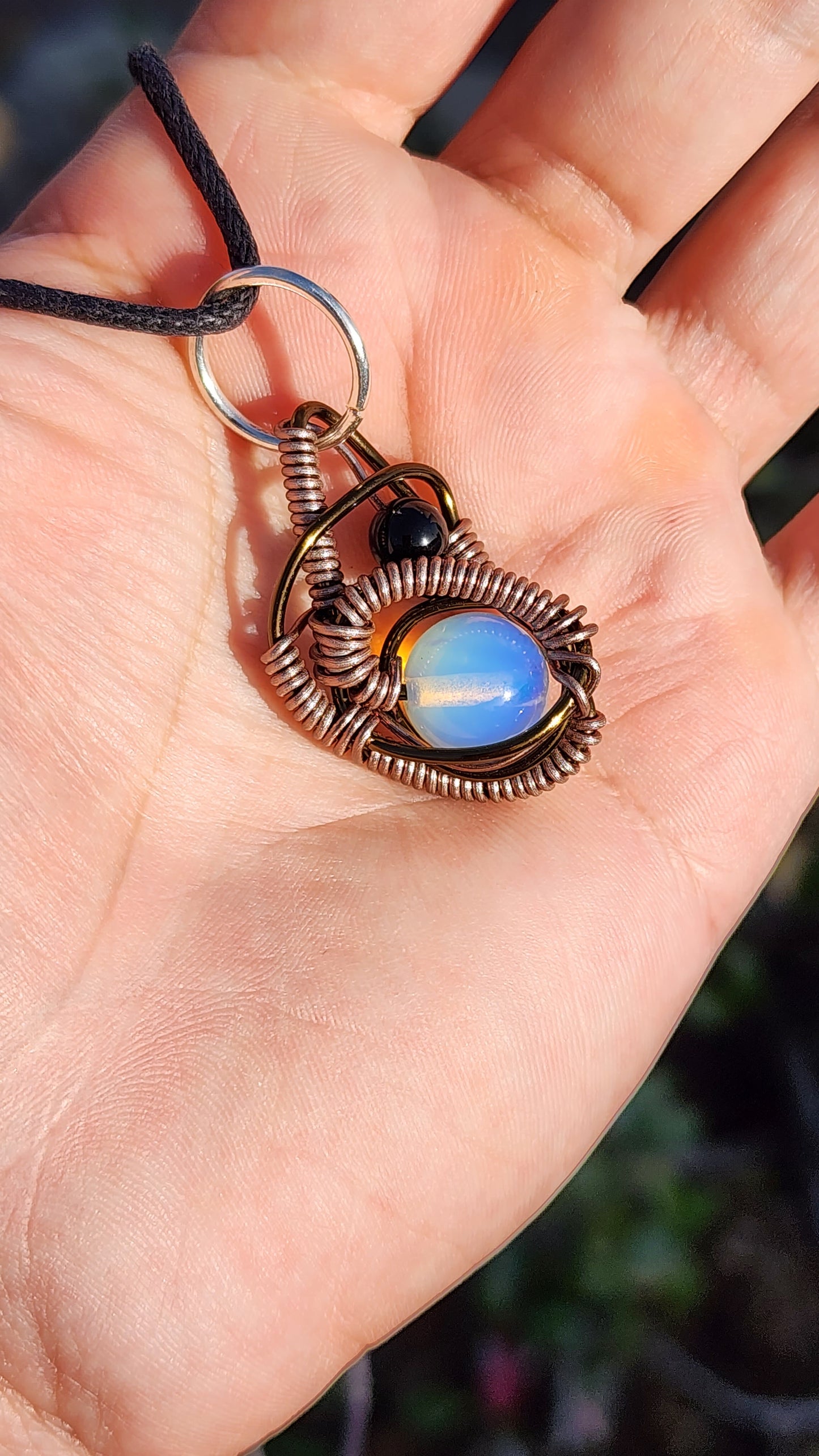 Soul Of A Serpent. Opalite and Obsidian necklace. Made by Eyesthatburnthemind.