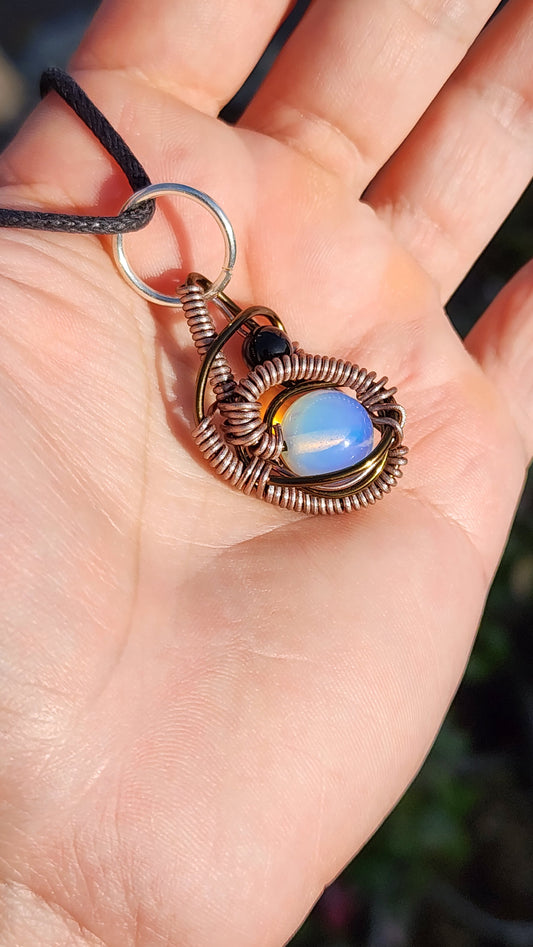 Soul Of A Serpent. Opalite and Obsidian necklace. Made by Eyesthatburnthemind.