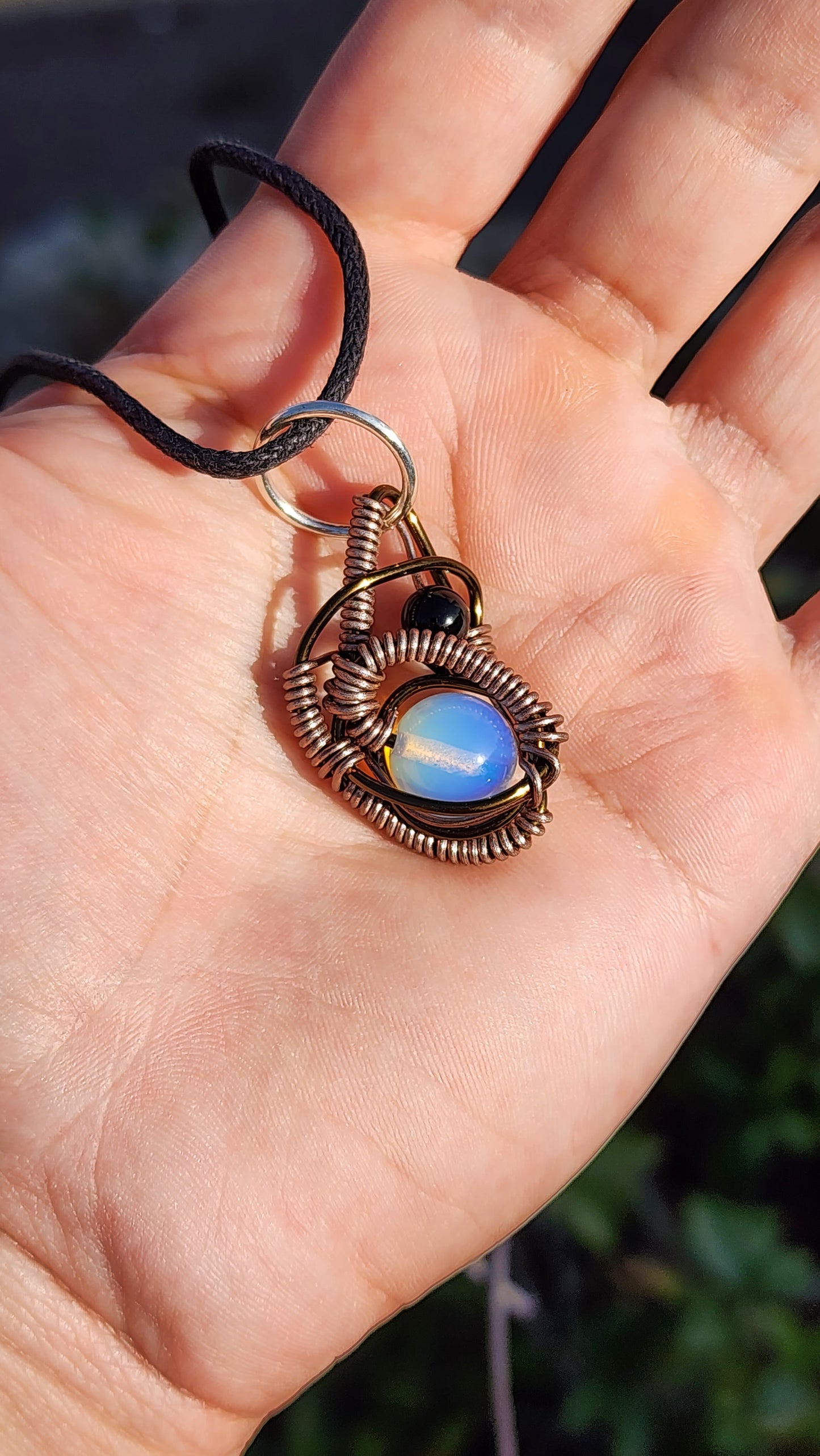 Soul Of A Serpent. Opalite and Obsidian necklace. Made by Eyesthatburnthemind.