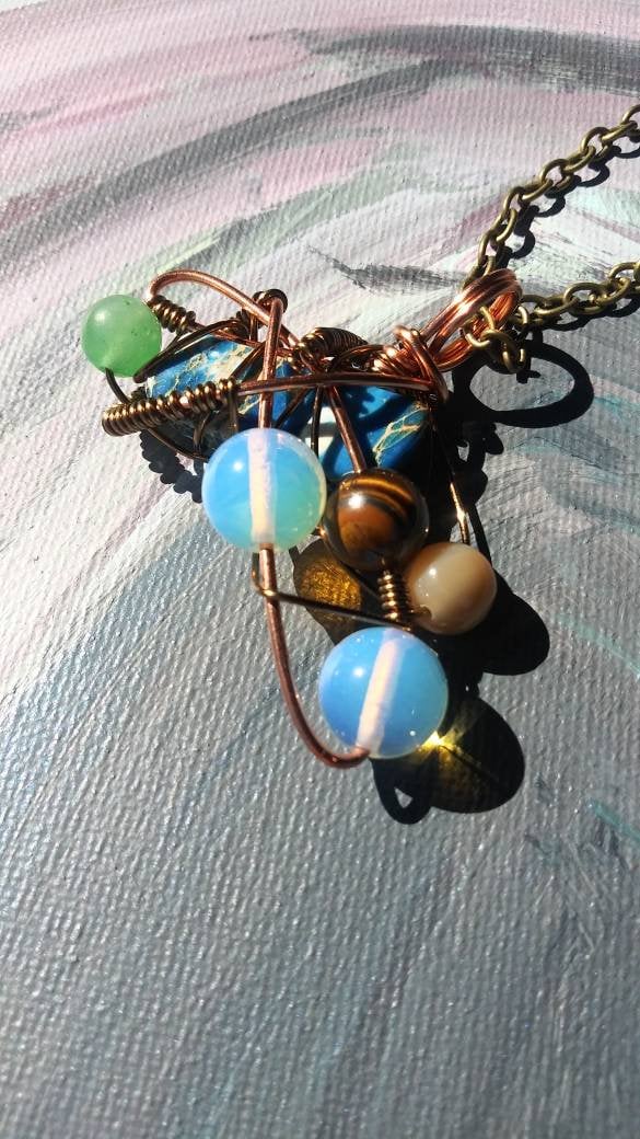 Broken Wing. Spiral. Opalite, adventurine, mother of pearl and tigers eye necklace. Made by Eyesthatburnthemind.