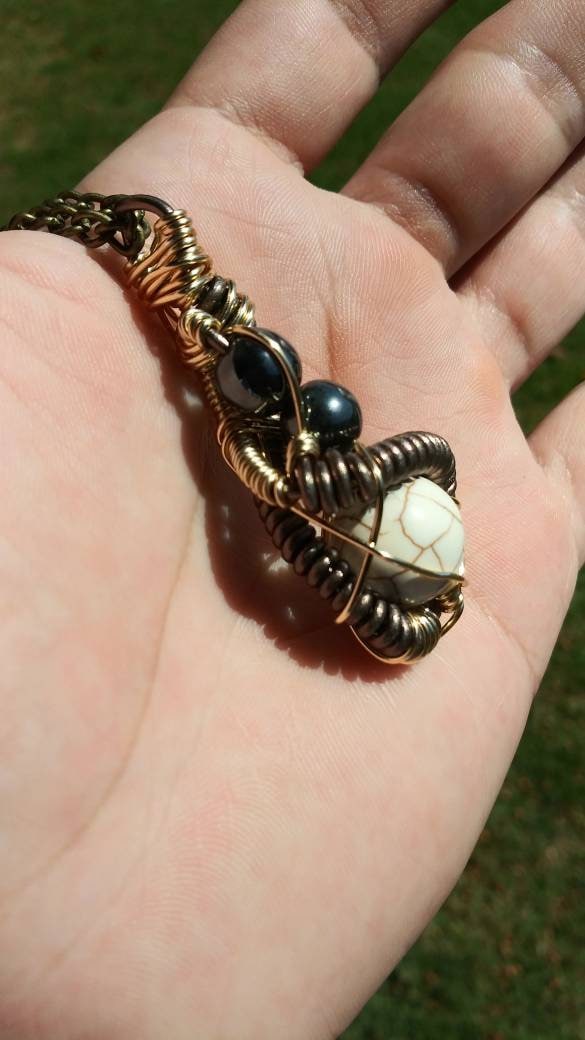 Darkness. Howlite and hematite necklace. Made by Eyesthatburnthemind.