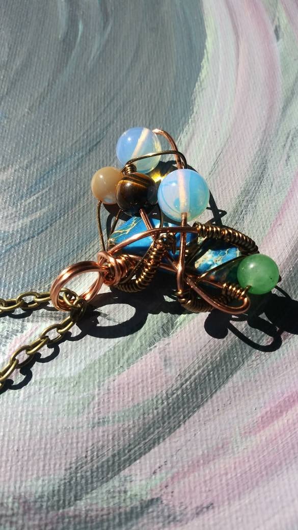 Broken Wing. Spiral. Opalite, adventurine, mother of pearl and tigers eye necklace. Made by Eyesthatburnthemind.