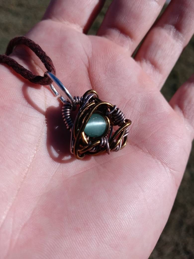 Nebulous. Cats Eye glass necklace. Made by Eyesthatburnthemind.