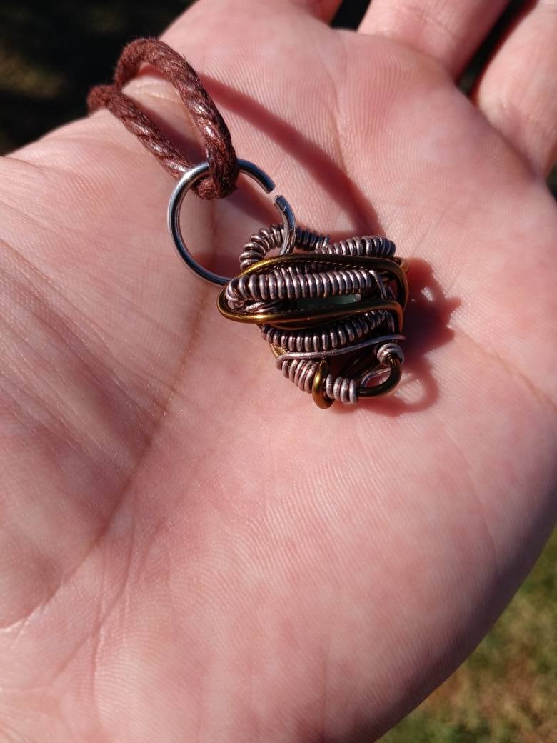 Nebulous. Cats Eye glass necklace. Made by Eyesthatburnthemind.