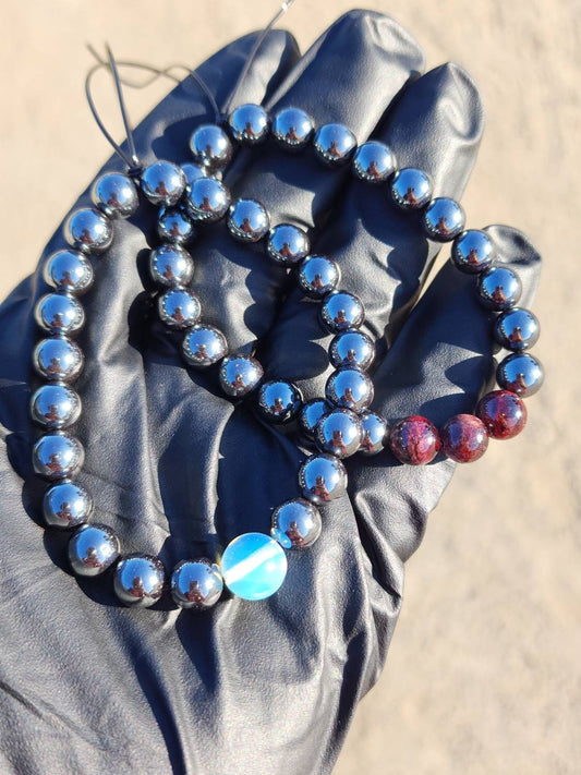 Mo·ral·i·ty. Pair of Hematite/ Opalite and Garnet bracelets. Your choice of size. Made by Eyesthatburnthemind.