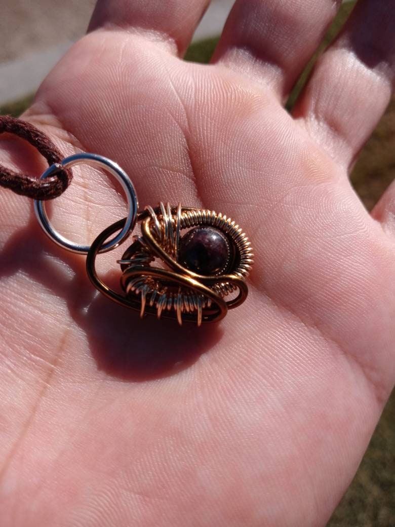 Ancient Contraption. Garnet crystal necklace. Made by Eyesthatburnthemind.