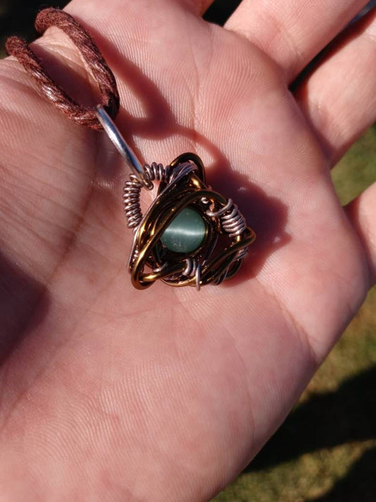 Nebulous. Cats Eye glass necklace. Made by Eyesthatburnthemind.
