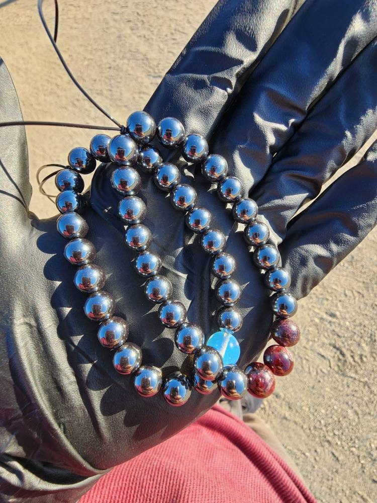 Mo·ral·i·ty. Pair of Hematite/ Opalite and Garnet bracelets. Your choice of size. Made by Eyesthatburnthemind.